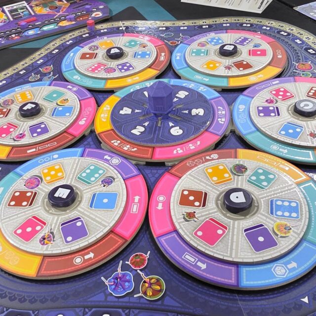 Weekend gaming! First up was Raas: A Dance of Love. Neat game of spinning gears, dice collecting and tableau building. Loved the colors and the theme, which is inspired by the Garba Raas folk dance style of India.

Pond! I cannot get enough of these cute, mean frogs who want to steal your lilypad. 

This Epic Pumpkin Frog is on brand for the season. 

Dreadful Meadows: This adorable Halloween candy theme game was a clever puzzle of either using your candy to buy more patches and build out your board, or satisfying concoction requirements for VPs. 

Eyelet: A simple string game where you maneuver the laces to trap your opponents. Very chill until it's not. Love the colors too. 

#boardgames #boardgamegeek #bgg #tabletopgames #boardgamesofinstagram